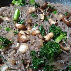 Garlic Mushroom, Kale & Broccoli w/Purple Sweet Potato noodles A picture of Garlic Mushroom, Kale & Broccoli w/Purple Sweet Potato noodles.