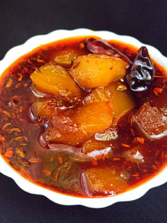 A picture of Sweet and sour raw mango curry.