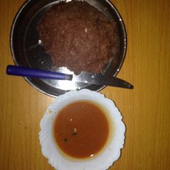 A picture of Millet ugali served with beef soup.