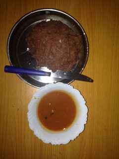 A picture of Millet ugali served with beef soup.