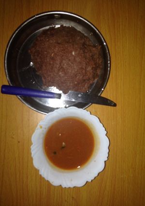 A picture of Millet ugali served with beef soup.