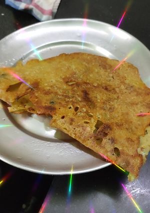 A picture of Onion Rava Dosa with nariyal chutney, sambar.