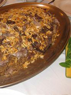 A picture of Lamb with rice and nuts - ouzet ghanam.