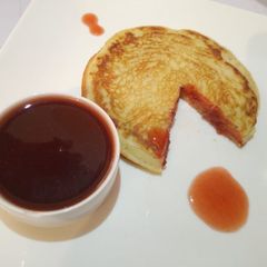 A picture of American Pancake with Jam sauce.