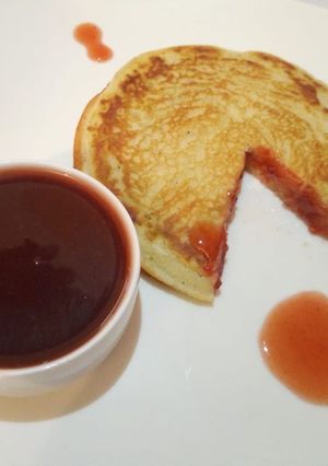 A picture of American Pancake with Jam sauce.