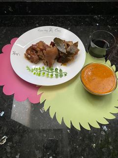 Una foto de Manitas de cerdo 🐷 en salsita