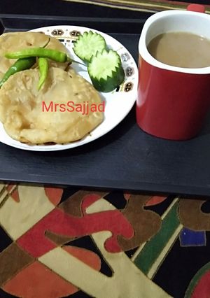 A picture of Daal Kachori With tea.