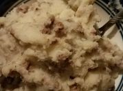 A picture of mashed potatoes and gravy