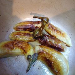 A picture of Pan frying aubergine.