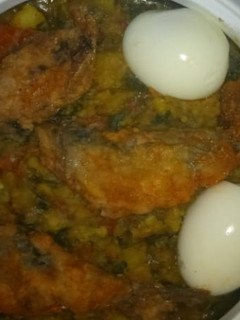 A picture of Beans and fish with boiled egg.