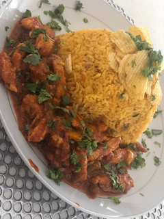 A picture of Mexican rice with Mexican Chicken.