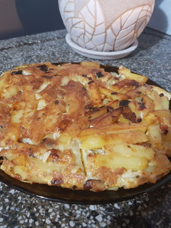 Una foto de Tortilla de papas y hongos shiitake