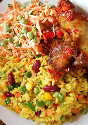 A picture of Fried rice,salad and fried chicken.