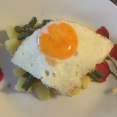 A picture of Green beans with potatoes and eggs.