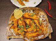 A picture of baked potato wedges and peppers