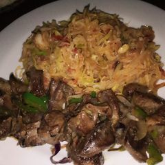 A picture of Fried goat heart served with veggies.