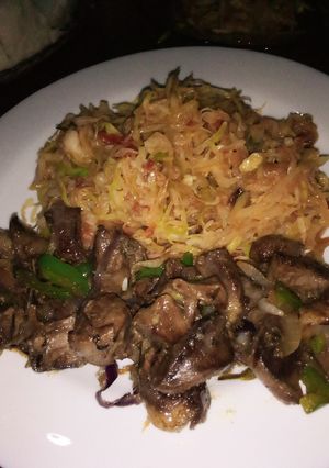 A picture of Fried goat heart served with veggies.