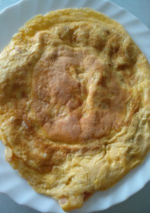 Una foto de Tortilla de boletus y quesito