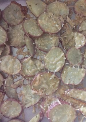 A picture of Baked Herb And Parmesan Potatoes.