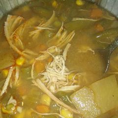 A picture of Chicken and veggie soup.