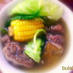 A picture of stewed beef in clear broth.
