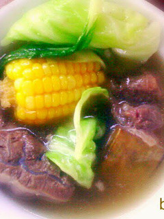 A picture of stewed beef in clear broth.
