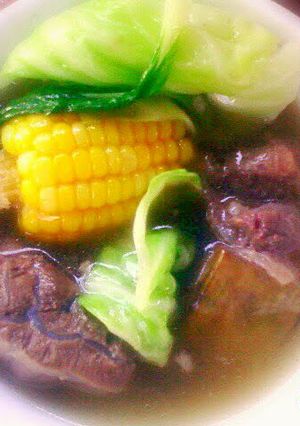 A picture of stewed beef in clear broth.