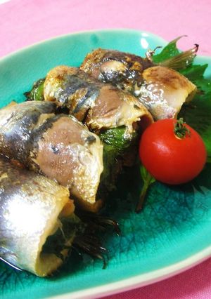 A picture of Grilled Sardine Rolls with Umeboshi and Shiso Leaves.