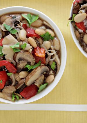 A picture of Ragout of Mixed Mushrooms, Roasted Red Peppers and Cannellini Beans over Garlic-Parmesan Grits.