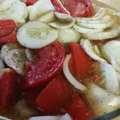 A picture of Cucumber tomato onion vinegar salad.