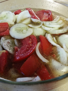 A picture of Cucumber tomato onion vinegar salad.