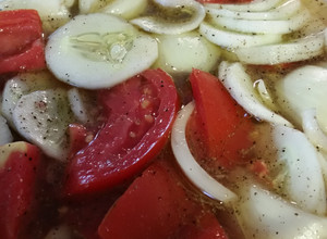 A picture of Cucumber tomato onion vinegar salad.