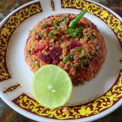 A picture of Oats upma with beetroot and vegetable.