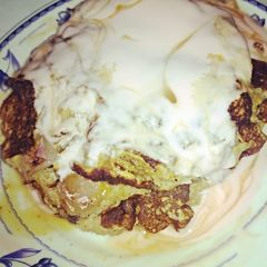 A picture of Coconut Pancake w/ yogurt n' honey.