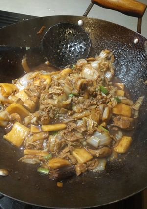 A picture of Szechuan Pork Belly with Rice Cakes.