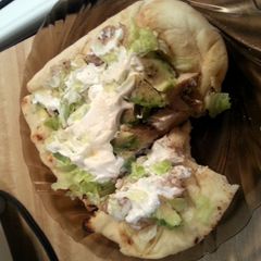 A picture of Grilled Chicken on flatbread.
