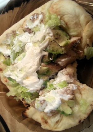 A picture of Grilled Chicken on flatbread.