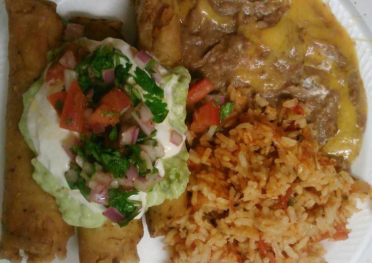 Rolled tacos with refried beans and Spanish rice