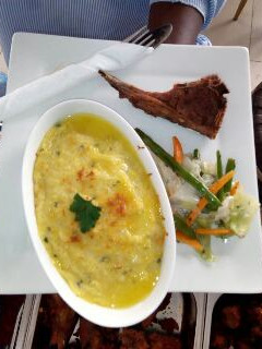 A picture of Mashed Potatoes and Mixed Vegetables.