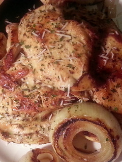 A picture of Caesar Marinated Chicken Breast with Grilled Onion Rings.