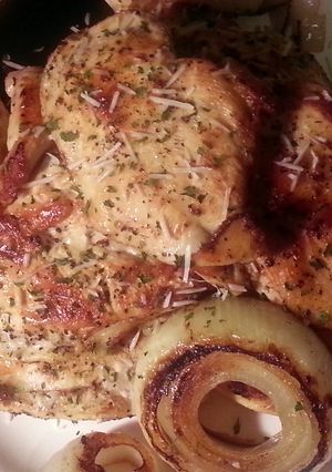 A picture of Caesar Marinated Chicken Breast with Grilled Onion Rings.