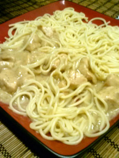 A picture of Chicken breast with white sauce.