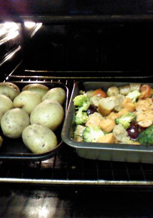 A picture of Cheaters guide to Garlic'd sausage casserole in a plum sauce with mini jackets and seasonal veg..