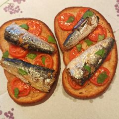 A picture of Bruschetta with sardines.