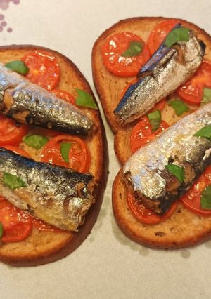 A picture of Bruschetta with sardines.