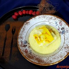 A picture of Bhapa Kesar Sandesh/Steamed Saffron Sandesh with Rabdi.