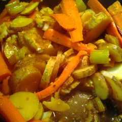 A picture of potato medallions and carrot planks.