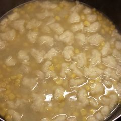 A picture of chicken corn soup.