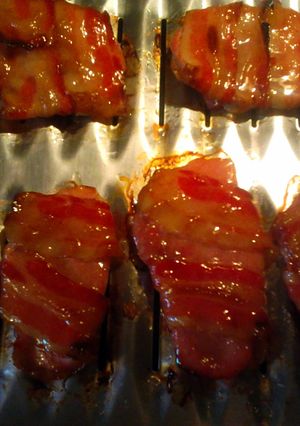 A picture of honey glazed bacon pork chops.
