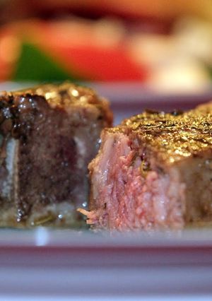 A picture of Iron Skillet-Seared Lamb Chops Covered with a Balsamic Reduction.